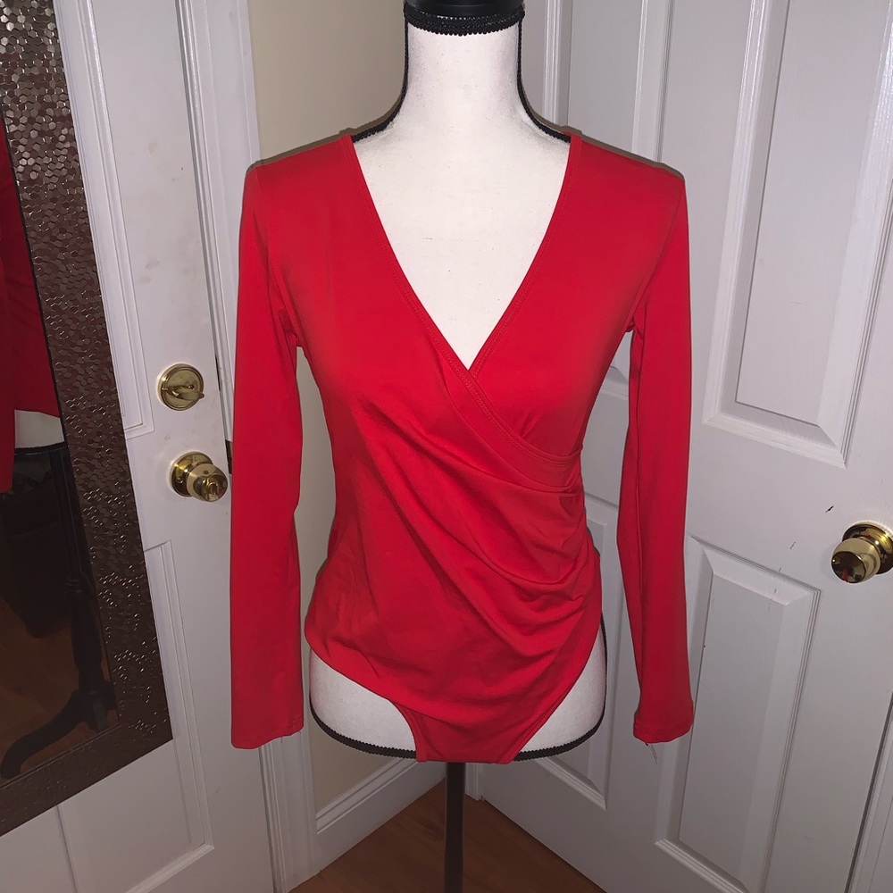 Cross bodysuit . Never worn